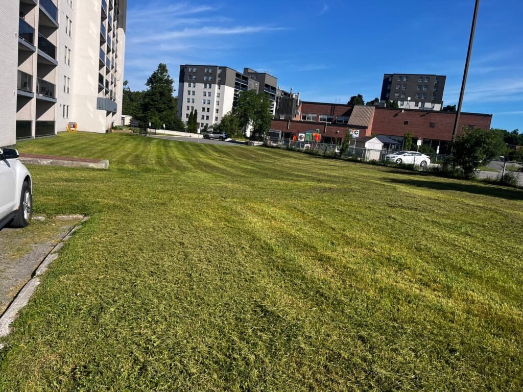 Commercial lawn mowing for apartment property in Peterborough